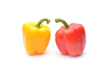 Colored peppers on white background