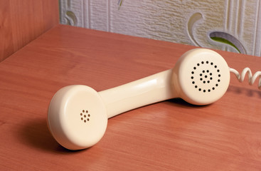 Vintage telephone handset on old table photo