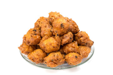 Heap of fried fritters or oliebollen on scale