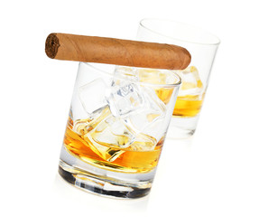 Two whiskey glasses and cigar