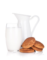 Milk jug, glass and cookies