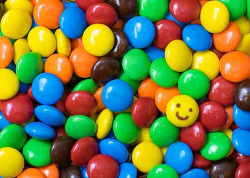 Smile face on colorful chocolate balls