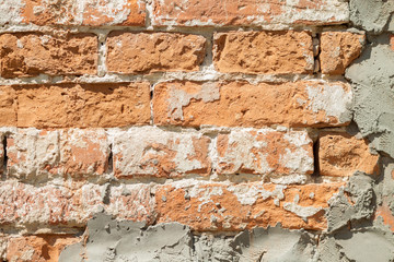 Brick wall. Vintage street brick background. Weathered texture of stainted old brik wall. Grunge rusty blocks. Urban wallpaper. Nature artistic texture.  