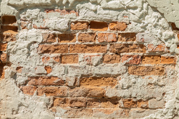 Brick wall. Vintage street brick background. Weathered texture of stainted old brik wall. Grunge rusty blocks. Urban wallpaper. Nature artistic texture.  