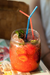 Strawberry mojito cocktail on a table in a cafe