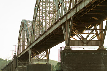 Under the bridge. Industrial wallpaper. Perspective. Symmetry. Concrete structures