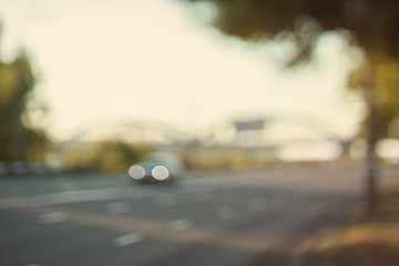 Fototapeta premium Blurred background photo.Cityscape bokeh. Defocused abstract city.Background out of focus.Can use as wallpaper, design. Summer blurry city backdrop.Travel out of focus photos. Fairy defocused photos. 