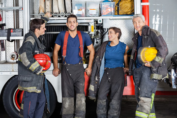 Fototapeta premium Team Of Confident Firefighters At Fire Station