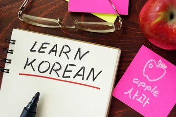 Fotobehang Words written learn korean in the notepad. © Vitalii Vodolazskyi