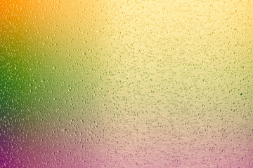 water drop on colorful metal surface