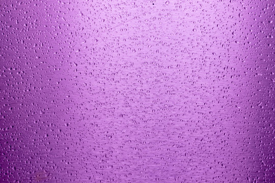 Water Drop On Purple Metal Surface