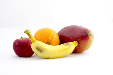 Banana, apple, orange and a mango on white background