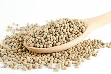 Pepper in wooden spoon  on white background.
