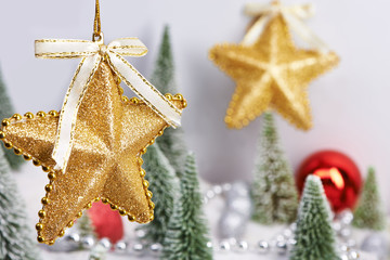 Fototapeta na wymiar Golden decorative stars as Christmas toys