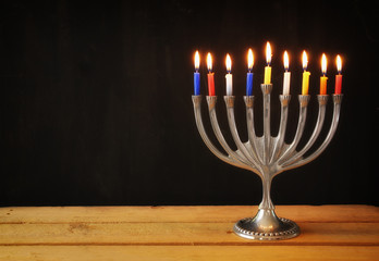 low key image of jewish holiday Hanukkah with menorah (traditional Candelabra)  with chalkboard background, room for text
