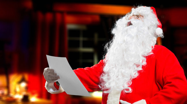 Santa Claus reading a letter 