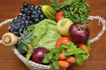 Fototapeta na wymiar White basket with fresh healthy vegetables and fruit