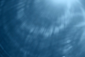 Blue abstract rays of light background