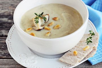 Mushroom and potato cream soup with mushroom topping. Selective focus. 
