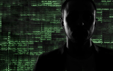 hacker at work with graphic user interface around