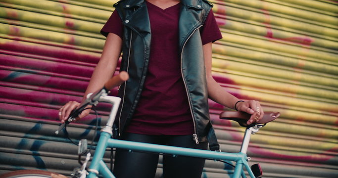 Girl's hands on the handlebar of classic fixed gear bike