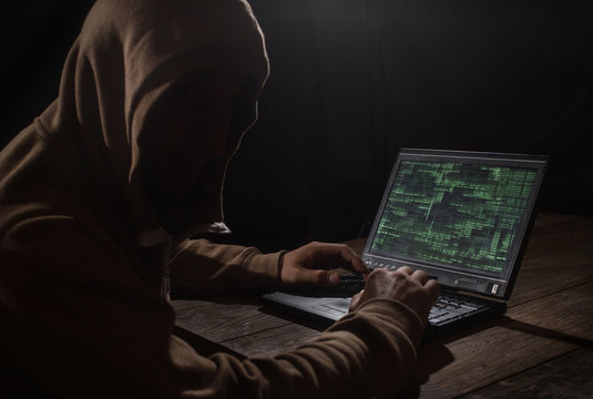 hacker at work with graphic user interface around