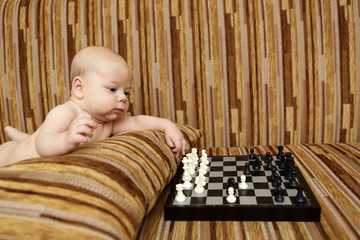 Baby playing chess