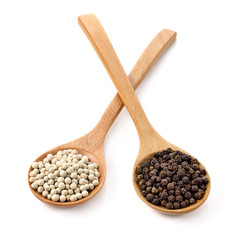 Wooden spoon and peppercorn on white background