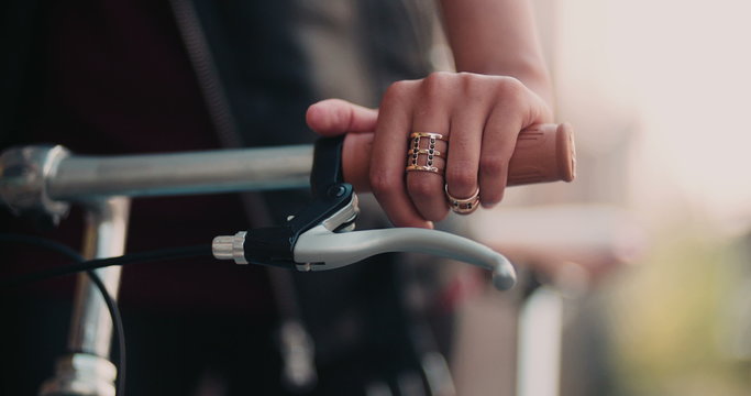 Girl's hands on the handlebar of classic fixed gear bike