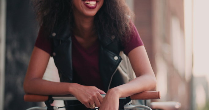 African American girl on a city street with her bicycle
