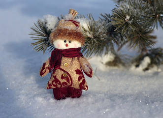 Toy snowman on the snow