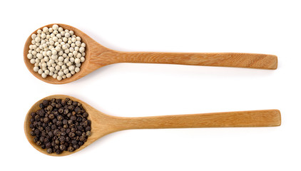 Wooden spoon and peppercorn on white background