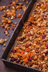 Granola from several types of cereals with nuts,honey,raisins