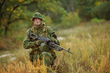 Fototapeta premium russian soldier in the battlefield with a rifle