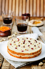 raw vegan carrot cake with cashew cream and dried cranberries