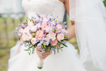 Wedding bouquet of lavender, roses and peonies. 