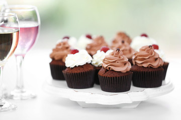 Tasting of wine and chocolate cupcakes, close up