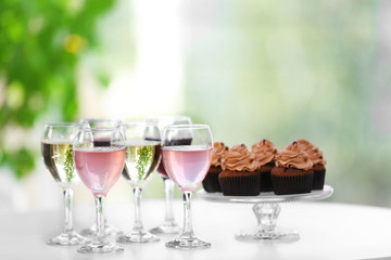 Tasting of wine and chocolate cupcakes, close up