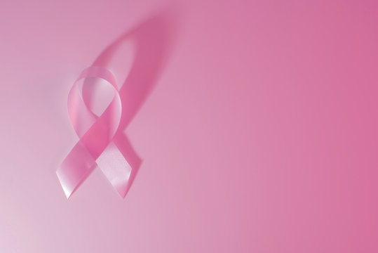 Breast cancer awareness ribbon pink background