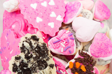 Closeup of delicious pile with cookies mostly pink colored