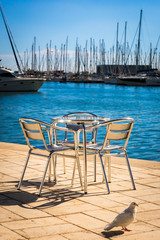 Fototapeta na wymiar Metal furniture by the sea