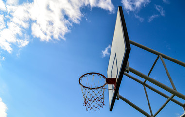 Basketball board with blue sky
