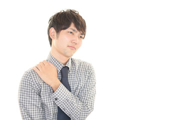 肩こりに悩む男性