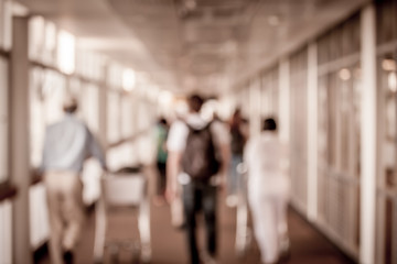 Blur image of passengers walking at airport