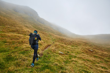 Obraz premium Caucasian hiker with backpack