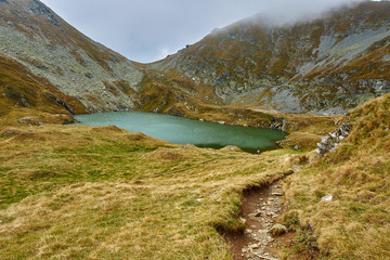 Fototapeta na wymiar Glacial lake in the mountains