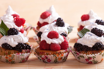 delicious homemade fruit cupcake with raspberries and blackberries