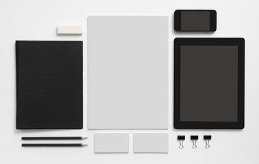 Set of stationery with tablet and mobile phone. 