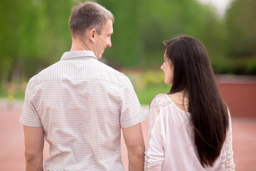 Couple walking, back view