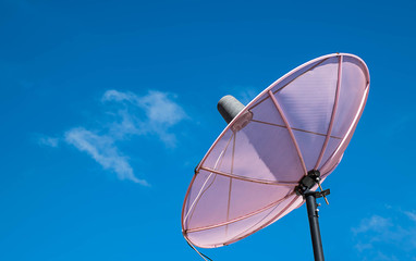 Pink Satellite on the roof with the sky background.